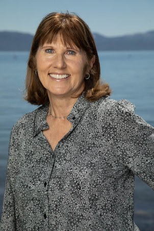Nancy Barton on the shore of Lake Tahoe